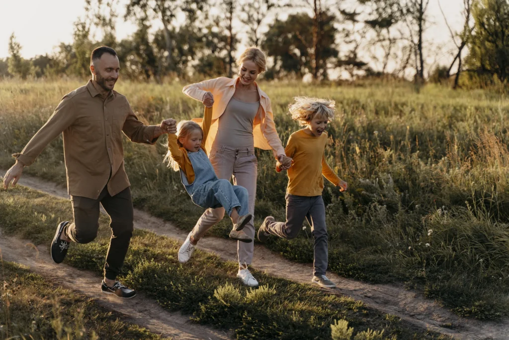 Family enjoying quality time together, symbolizing financial freedom through smart wealth planning.