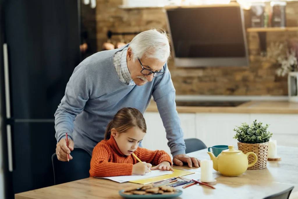 Grandparent providing support thanks to long-term financial stability from wealth management planning.