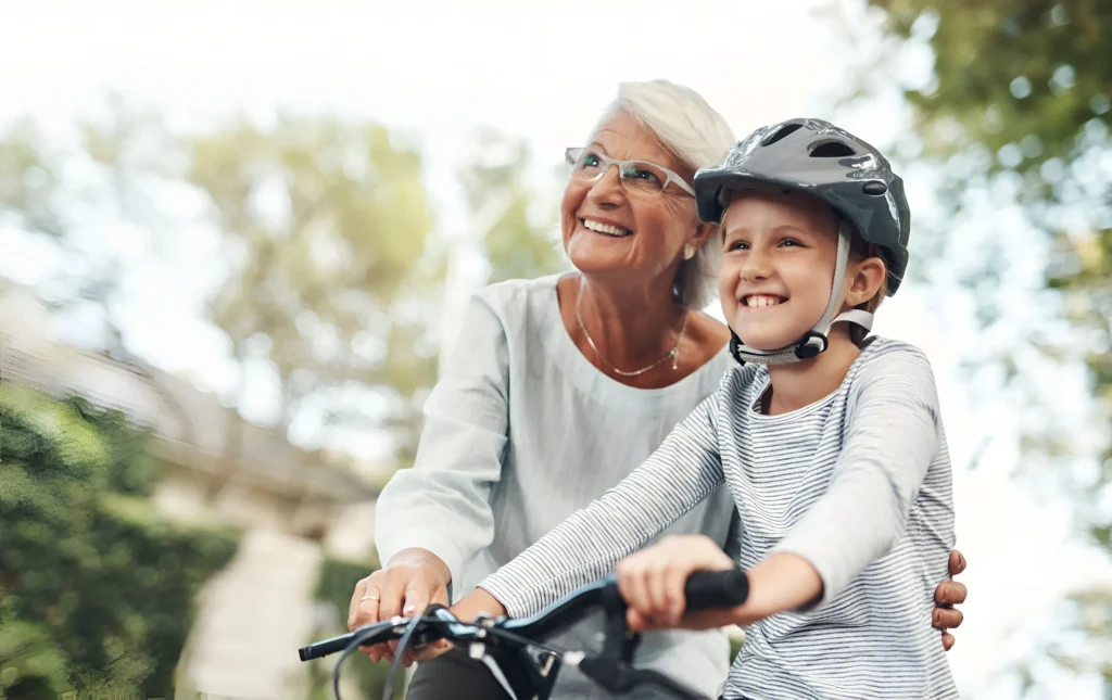 Generational wealth planning symbolized by grandmother and child enjoying financial stability together.